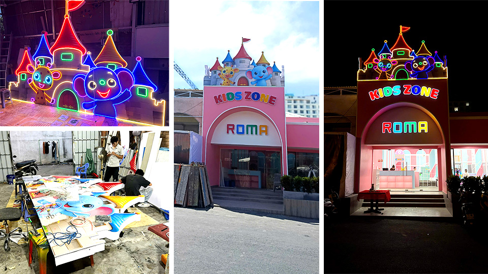 Mặt tiền Kids Zone ROMA ban đêm phát sáng outline lâu đài và chữ Kids Zone
